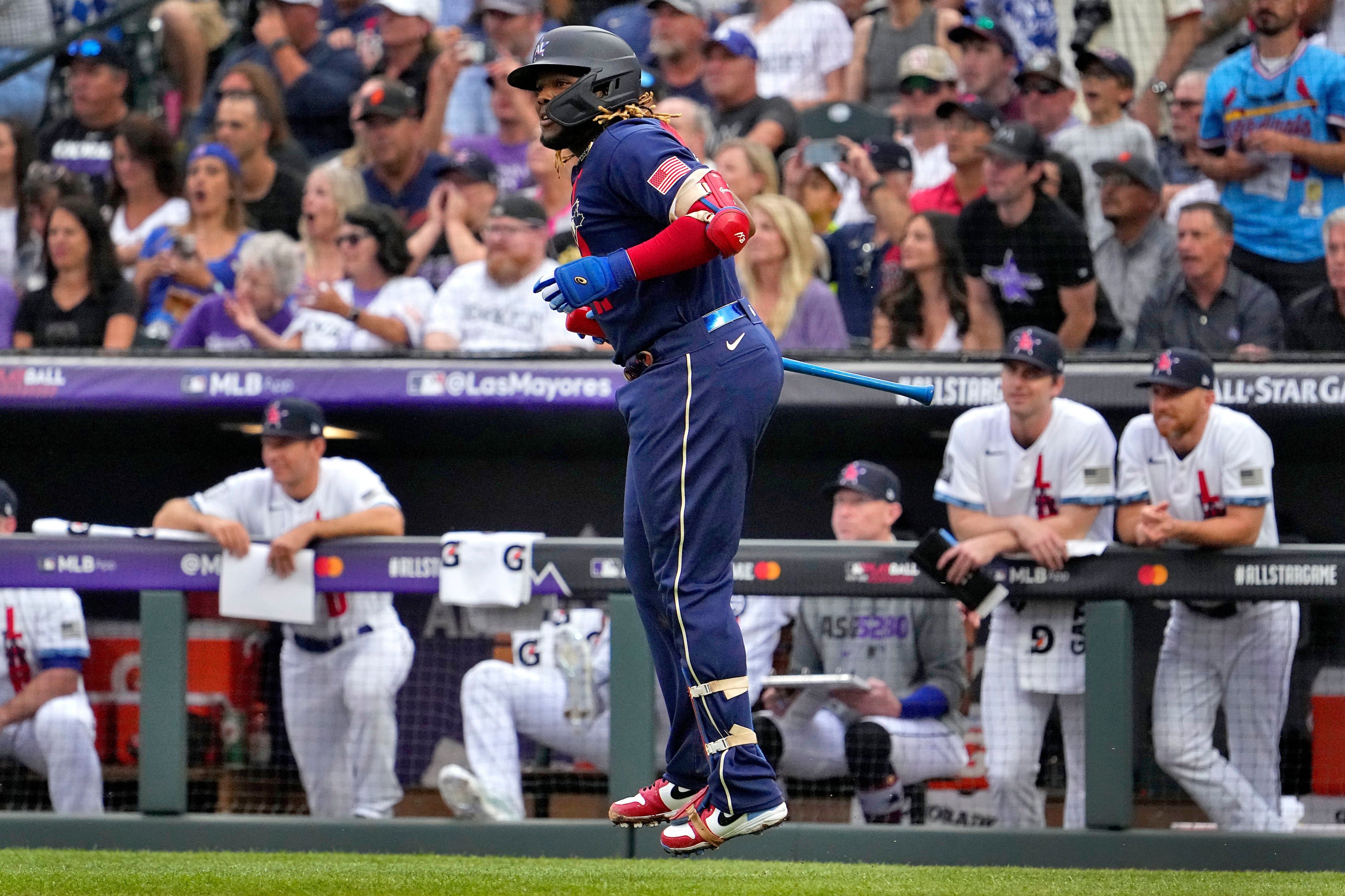 Alonso wears catcher's gear in the dugout 