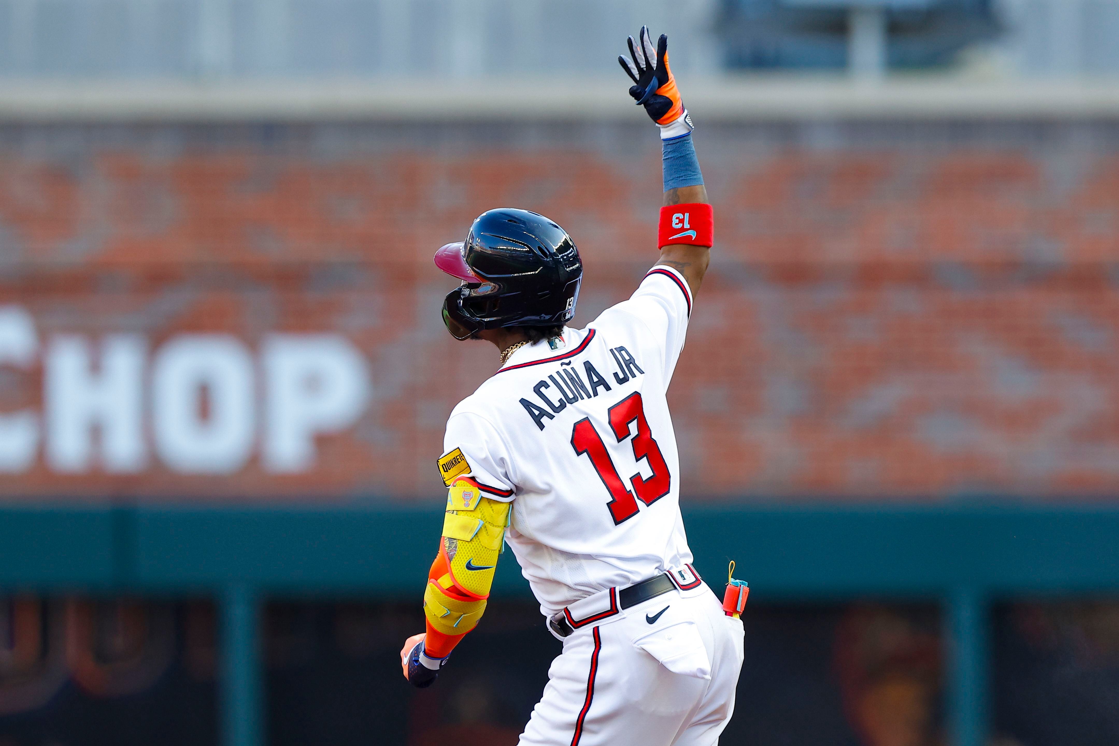 Atlanta Braves third baseman Austin Riley reacts with a chop after